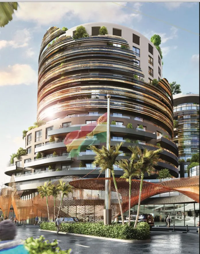 Curved residential towers wrapped in cascading green terraces